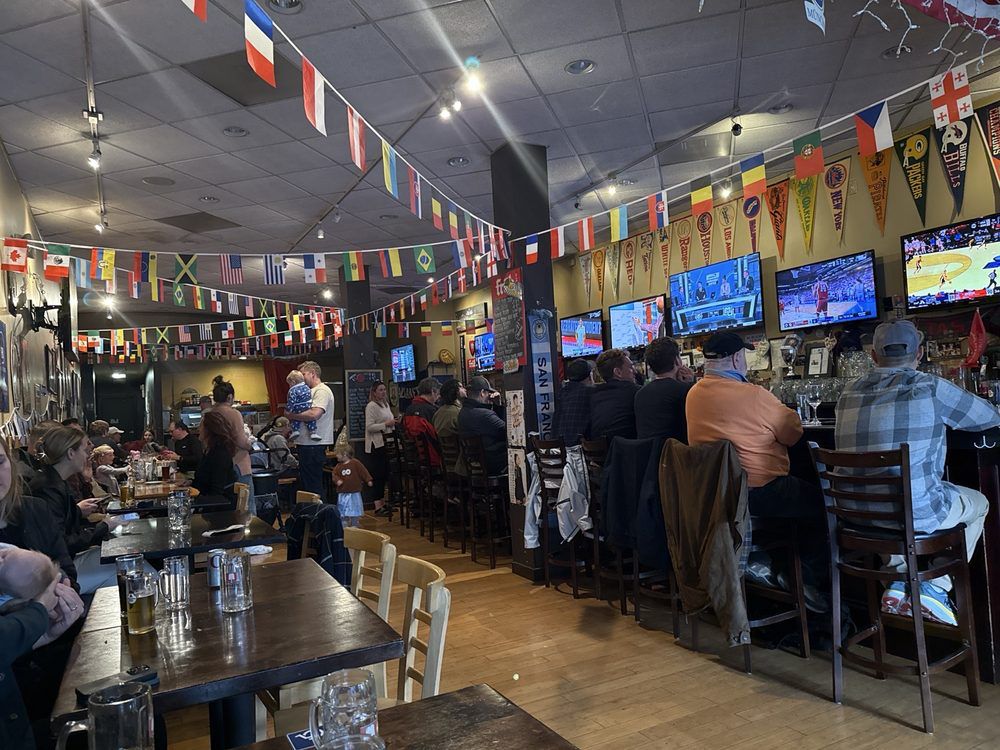 Golden craft beer in a glass with warm bar lighting at Steins restaurant